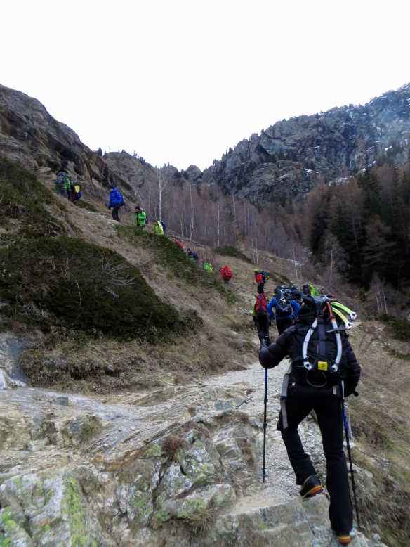 Walking up to the dry tooling crag. A colourful crowd.